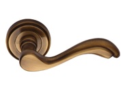 Heritage Brass Lisboa Door Handles On Round Rose, Antique Brass - V1601-AT (sold in pairs)