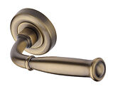 Heritage Brass Lincoln Design Door Handles On Round Rose, Antique Brass - V1938-AT (sold in pairs)