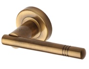 Heritage Brass Alicia Door Handles On Round Rose, Antique Brass - V2100-AT (sold in pairs)