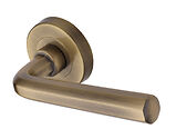 Heritage Brass Octave Design Door Handles On Round Rose, Antique Brass - V4545-AT (sold in pairs)