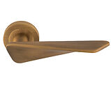 Carlisle Brass Manital Intona Door Handles On Round Rose, Antique Brass - IN5AB (sold in pairs)