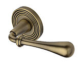 Heritage Brass Roma Reeded Design Door Handles On Round Rose, Antique Brass - RR7156-AT (sold in pairs)