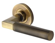 Heritage Brass Signac Knurled Door Handles On Round Rose, Antique Brass - RS2260-AT (sold in pairs)