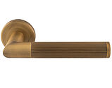 Carlisle Brass Serozzetta Trend Lines Door Handles On Round Rose, Antique Brass - SZM170AB (sold in pairs)