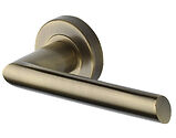 Heritage Brass Mercury Design Door Handles On Round Rose, Antique Brass - V3262-AT (sold in pairs)