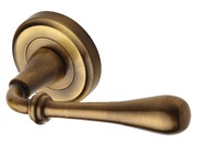 Heritage Brass Roma Door Handles On Round Rose, Antique Brass - V7155-AT (sold in pairs)
