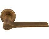 Carlisle Brass Manital Spring Door Handles On Round Rose, Antique Brass - VV5AB (sold in pairs)