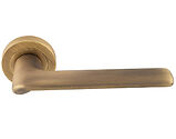 Carlisle Brass Manital Vortex Door Handles On Round Rose, Antique Brass - VX5AB (sold in pairs)